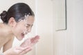 A beautiful woman is washing her face Royalty Free Stock Photo