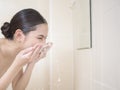 A beautiful woman is washing her face Royalty Free Stock Photo