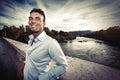 Beautiful smiling Italian man outdoors in Rome Italy. Tiber river from the bridge Royalty Free Stock Photo