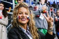 Beautiful smiling lady supporting of France national football team.