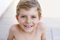 Beautiful Smiling Little Boy Portrait on warm sunny summer day. Happy kid looking at the camera. Adorable child with Royalty Free Stock Photo