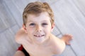 Beautiful Smiling Little Boy Portrait on warm sunny summer day. Happy kid looking at the camera. Adorable child with Royalty Free Stock Photo