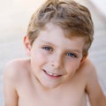 Beautiful Smiling Little Boy Portrait on warm sunny summer day. Happy kid looking at the camera. Adorable child with Royalty Free Stock Photo