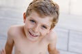 Beautiful Smiling Little Boy Portrait on warm sunny summer day. Happy kid looking at the camera. Adorable child with Royalty Free Stock Photo