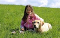 Beautiful smiling little girl with labrador dog Royalty Free Stock Photo