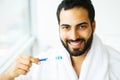 Beautiful Smiling Man Brushing Healthy White Teeth With Brush. H Royalty Free Stock Photo