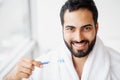 Beautiful Smiling Man Brushing Healthy White Teeth With Brush. H Royalty Free Stock Photo