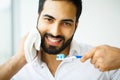 Beautiful Smiling Man Brushing Healthy White Teeth With Brush. H Royalty Free Stock Photo