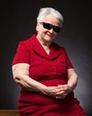 Beautiful smiling old woman in sunglasses