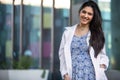 Beautiful smiling portrait of Indian American woman, medical practitioner, dental hygienist, scientist, health care specialist in Royalty Free Stock Photo