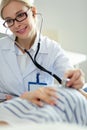 Beautiful smiling pregnant woman with the doctor at hospital Royalty Free Stock Photo