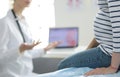 Beautiful smiling pregnant woman with the doctor at hospital Royalty Free Stock Photo