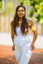Beautiful smiling pregnant woman standing in her garden at home Royalty Free Stock Photo