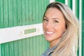 Beautiful Smiling pretty Woman on wooden trendy green wall hut background Royalty Free Stock Photo