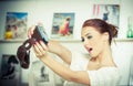 Beautiful, smiling red hair woman taking photos of herself with a camera. Fashionable attractive female taking a self portrait Royalty Free Stock Photo