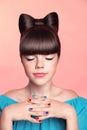 Beautiful smiling teen girl with bow hairstyle, makeup and colourful manicured polish nails. Funny girl in blue dress showing man Royalty Free Stock Photo