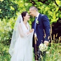 Beautiful smiling wedding couple in love. Outdoors portrait Royalty Free Stock Photo