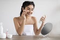 Beautiful Smiling Woman Cleansing Skin With Makeup Remover Lotion And Cotton Pad Royalty Free Stock Photo