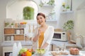 Beautiful Smiling Woman Eating Fresh Organic Vegetarian Salad In Modern Kitchen Royalty Free Stock Photo