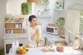 Beautiful Smiling Woman Eating Fresh Organic Vegetarian Salad In Modern Kitchen Royalty Free Stock Photo