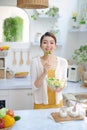 Beautiful Smiling Woman Eating Fresh Organic Vegetarian Salad In Modern Kitchen Royalty Free Stock Photo