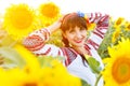 Beautiful smiling woman in embrodery on a sunflower field Royalty Free Stock Photo