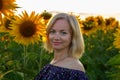 Beautiful smiling woman in the field with sunflowers Royalty Free Stock Photo