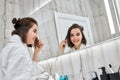 beautiful smiling woman in front of mirror Royalty Free Stock Photo