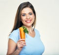 Beautiful smiling woman holding glass with carrot. Royalty Free Stock Photo
