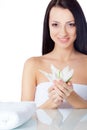 Beautiful smiling woman holding lily flower Royalty Free Stock Photo