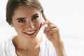 Beautiful Smiling Woman Holding Mobile Phone In Her Hand Royalty Free Stock Photo