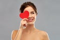 Beautiful smiling woman holding red heart Royalty Free Stock Photo