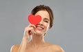 Beautiful smiling woman holding red heart Royalty Free Stock Photo