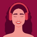 Beautiful smiling woman listening to music in headphones. Happy girl in headphones Royalty Free Stock Photo