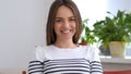 Beautiful Smiling Woman Looking at Camera in Office