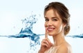 Beautiful smiling woman making hush gesture Royalty Free Stock Photo