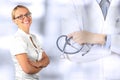 Beautiful smiling woman. Medicine. Doctor standing with stethoscope
