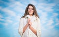 Beautiful smiling woman with perfect smile against the blue sky Royalty Free Stock Photo