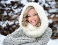 Beautiful smiling woman with a perfect smile. Happy sincere winter outdoor portrait of attractive model in winter clothes Royalty Free Stock Photo