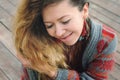 Beautiful smiling woman portrait dressed in gray knitted jersey