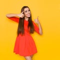 Beautiful Smiling Woman In Red Mini Dress Is Showing Thumbs Up Royalty Free Stock Photo