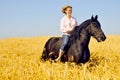 Beautiful smiling woman rides horse