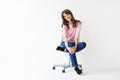 Beautiful smiling woman sitting on chair with copy space Royalty Free Stock Photo