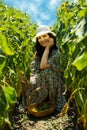 Beautiful smiling woman in sunflowers field Royalty Free Stock Photo