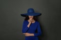 Beautiful smiling woman in wide blue broad brim hat. Beauty , makeup and cosmetics Royalty Free Stock Photo