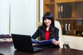 Beautiful smiling woman working with documents in office Royalty Free Stock Photo