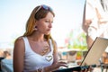 Beautiful smiling woman working on laptop. Royalty Free Stock Photo