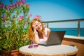 Beautiful smiling woman working on laptop. Royalty Free Stock Photo