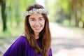 Beautiful smiling woman with a wreath on his head in the summer park Royalty Free Stock Photo