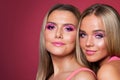 Beautiful smiling women models with makeup on pink Royalty Free Stock Photo